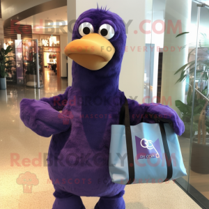 Purple Dodo Bird mascot costume character dressed with a Long Sleeve Tee and Tote bags