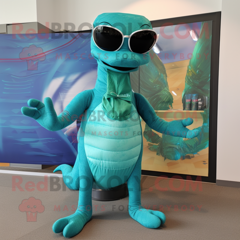 Turquoise Loch Ness Monster mascot costume character dressed with a ...