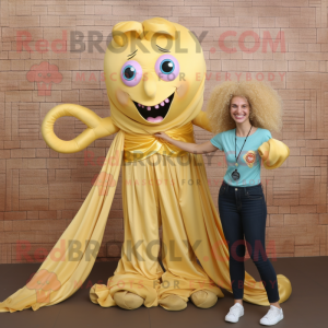 Gold Medusa mascot costume character dressed with a Mom Jeans and Bow ties