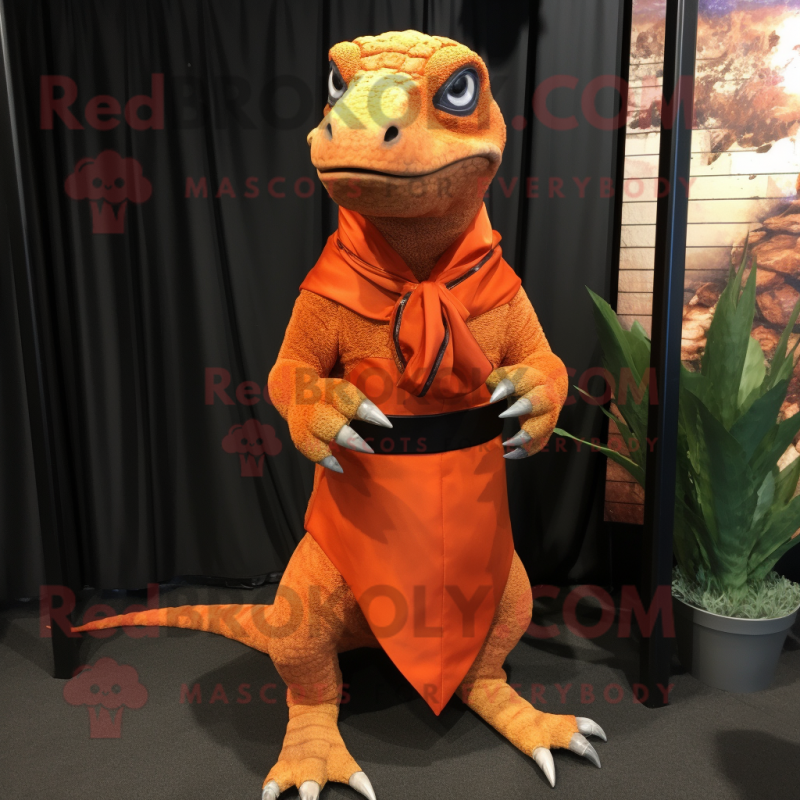 Orange Komodo Dragon mascot costume character dressed with a Wrap Skirt and Ties Orange Komodo Dragon mascot costume character dressed with a Wrap Skirt and Ties