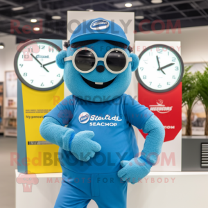 Blue Wrist Watch mascot costume character dressed with a Jumpsuit and Reading glasses