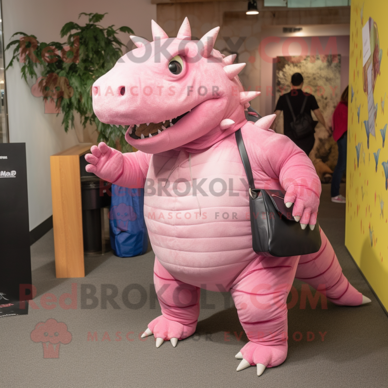 Pink Ankylosaurus mascot costume character dressed with a Jeggings and Messenger bags