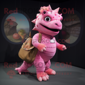 Pink Ankylosaurus mascot costume character dressed with a Jeggings and Messenger bags
