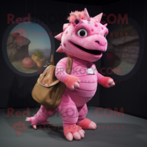 Pink Ankylosaurus mascot costume character dressed with a Jeggings and Messenger bags