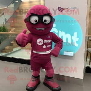 Magenta Plum mascot costume character dressed with a Rash Guard and Smartwatches