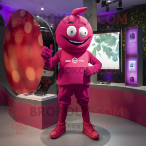 Magenta Plum mascot costume character dressed with a Rash Guard and Smartwatches