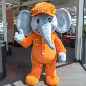 Orange Elephant mascot costume character dressed with a Dungarees and Pocket squares