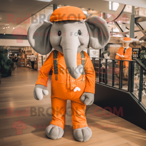 Orange Elephant mascot costume character dressed with a Dungarees and Pocket squares