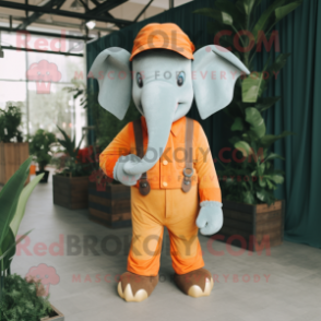 Orange Elephant mascot costume character dressed with a Dungarees and Pocket squares