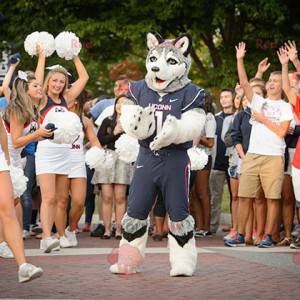 Mascotte del husky del cane lupo in abbigliamento sportivo -