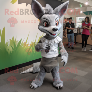 Silver Chupacabra mascot costume character dressed with a Skirt and Messenger bags