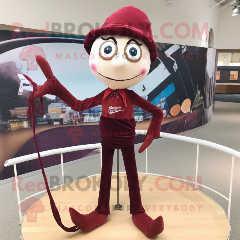 Maroon Tightrope Walker mascot costume character dressed with a Skinny Jeans and Shawl pins