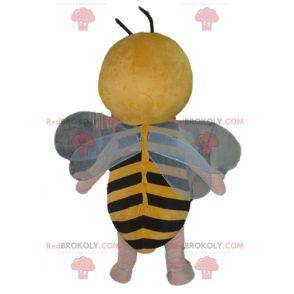 Menino mascote em fantasia de abelha amarela e preta -