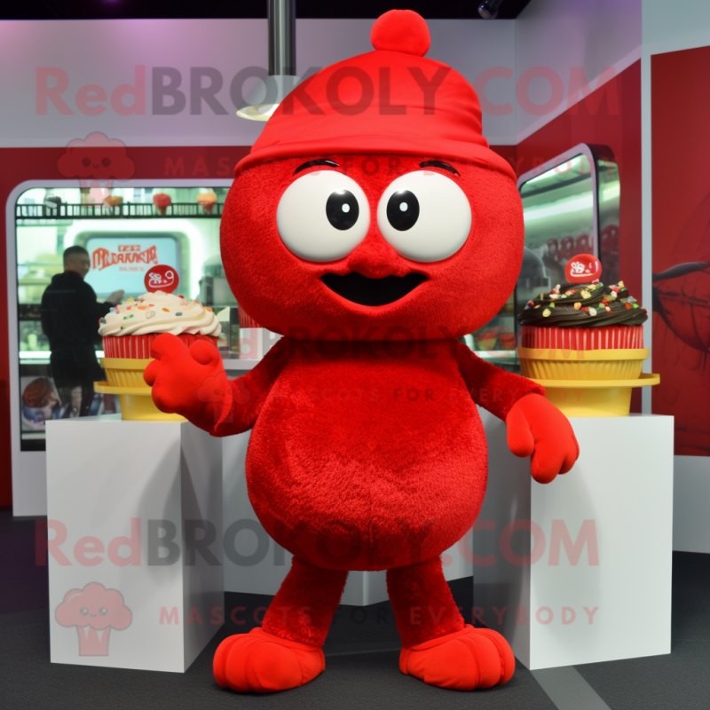 Red Cupcake mascot costume character dressed with a T-Shirt and Beanies Red Cupcake mascot costume character dressed with a T-Shirt and Beanies