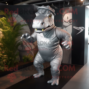 Silver Iguanodon mascot costume character dressed with a Running Shorts and Headbands