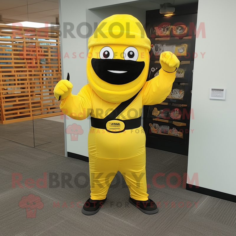 Yellow Ninja mascot costume character dressed with a A-Line Skirt and Hat pins Yellow Ninja mascot costume character dressed with a A-Line Skirt and Hat pins