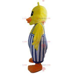 Mascotte de poussin de canard jaune avec une salopette -