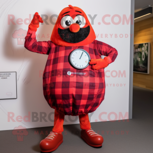 Red Shakshuka mascot costume character dressed with a Flannel Shirt and Smartwatches