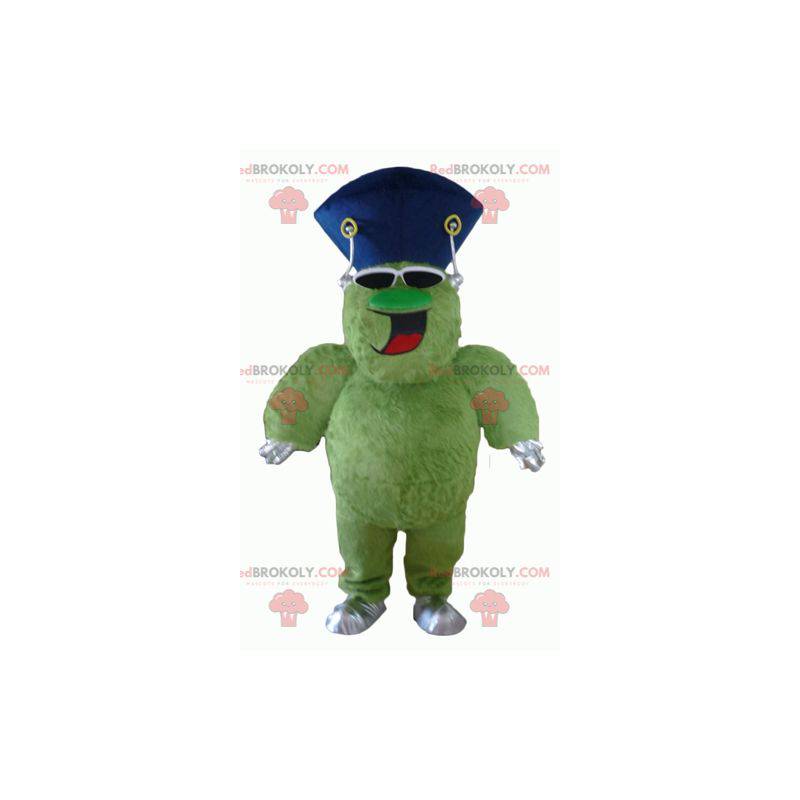 Mascote monstro verde peludo e gordo muito sorridente -