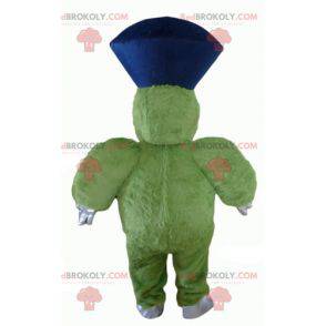 Mascote monstro verde peludo e gordo muito sorridente -