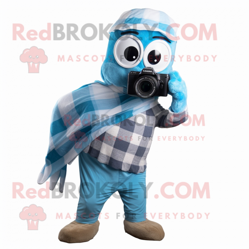 Sky Blue Camera mascot costume character dressed with a Flannel Shirt and Scarves