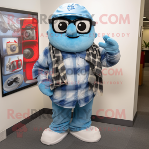 Sky Blue Camera mascot costume character dressed with a Flannel Shirt and Scarves