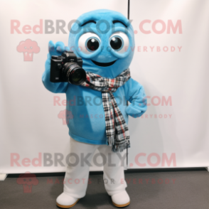 Sky Blue Camera mascot costume character dressed with a Flannel Shirt and Scarves