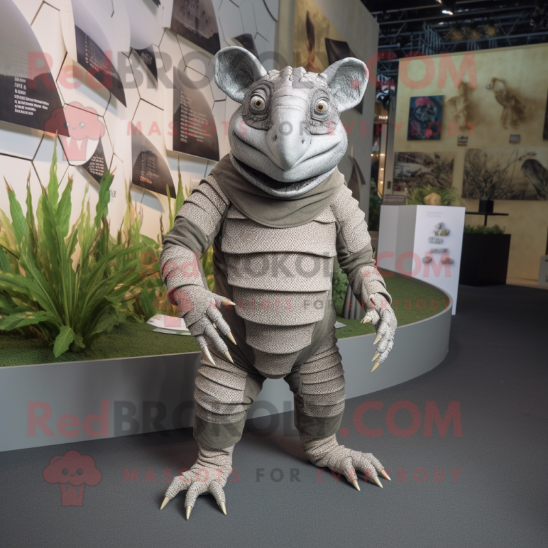 Gray Armadillo mascot costume character dressed with a Romper and Foot pads