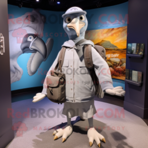 Gray Albatross mascot costume character dressed with a Henley Tee and Backpacks