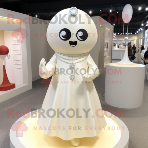 Cream Engagement Ring mascot costume character dressed with a A-Line Dress and Keychains