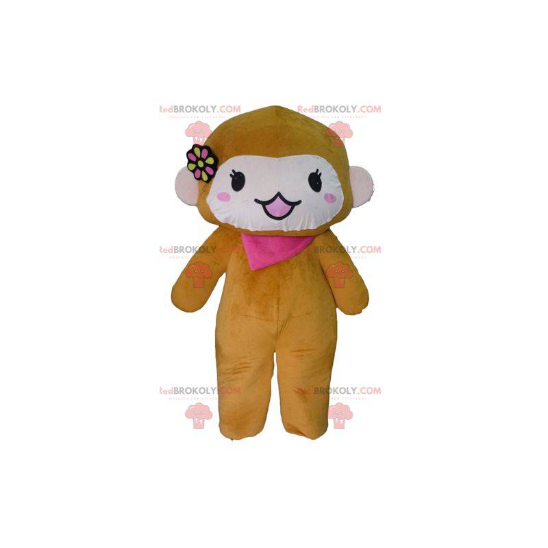Mascota mono marrón y rosa con una bufanda y una flor. -