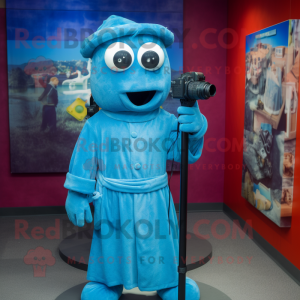 Blue Camera mascot costume character dressed with a Cover-up and Cummerbunds