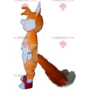 Orange und weißer Fuchs Maskottchen mit blauen Augen -