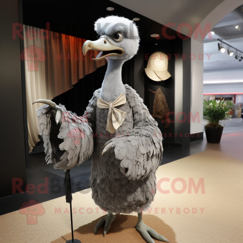 Gray Ostrich mascot costume character dressed with a Wrap Dress and Cufflinks Gray Ostrich mascot costume character dressed with a Wrap Dress and Cufflinks