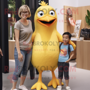 Yellow Blackbird mascot costume character dressed with a Mom Jeans and Suspenders