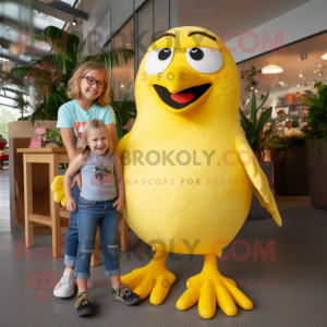 Yellow Blackbird mascot costume character dressed with a Mom Jeans and Suspenders