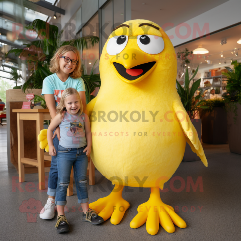 Yellow Blackbird mascot costume character dressed with a Mom Jeans and Suspenders Yellow Blackbird mascot costume character dressed with a Mom Jeans and Suspenders