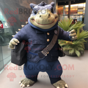 Navy Ankylosaurus mascot costume character dressed with a Long Sleeve Tee and Messenger bags