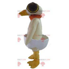 Mascotte de canard beige dans une coquille d'œuf -