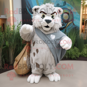 Gray Saber-Toothed Tiger mascot costume character dressed with a Cover-up and Tote bags