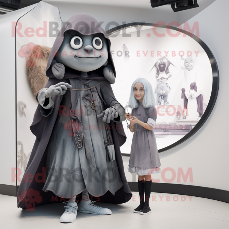 Gray Witch mascot costume character dressed with a Wrap Dress and Watches Gray Witch mascot costume character dressed with a Wrap Dress and Watches