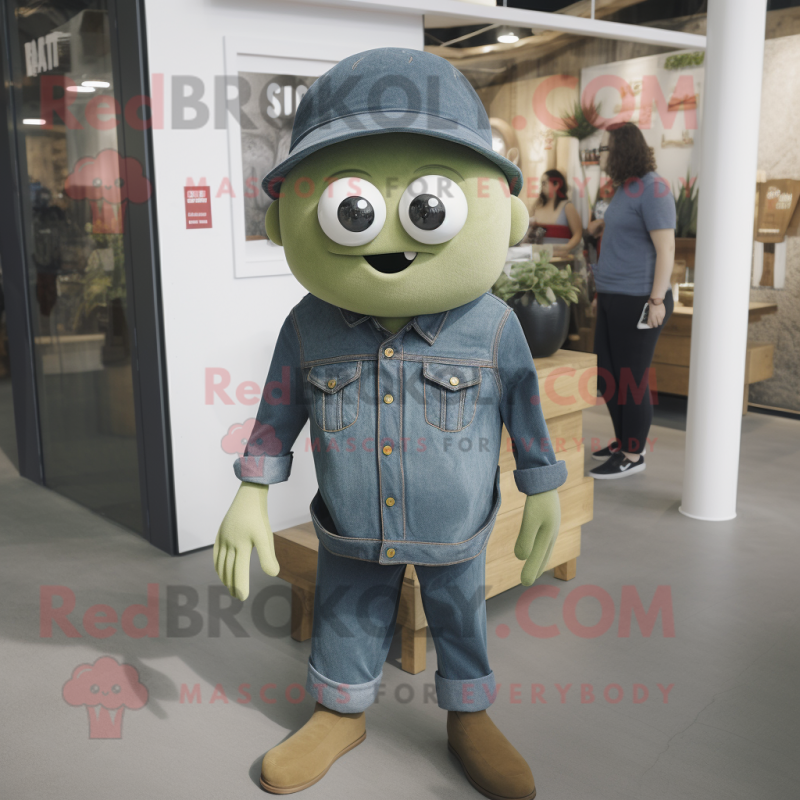 Olive Cyclops mascot costume character dressed with a Denim Shirt and Hat pins Olive Cyclops mascot costume character dressed with a Denim Shirt and Hat pins