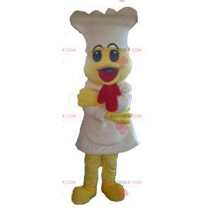 Mascot pollito amarillo con un delantal y un sombrero blanco -