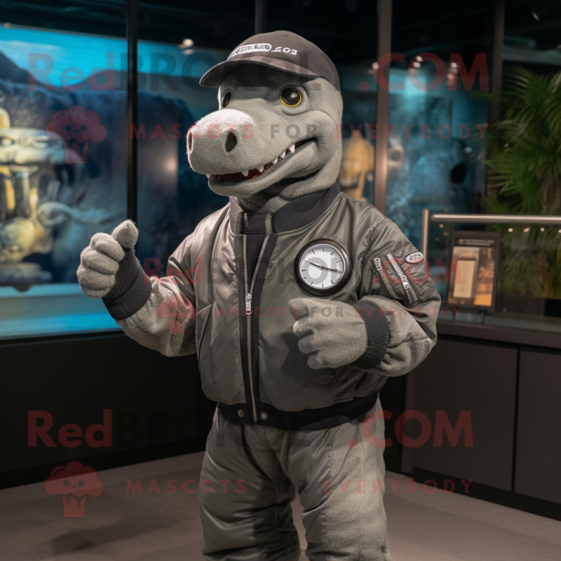 Gray Loch Ness Monster mascot costume character dressed with a Bomber Jacket and Smartwatches