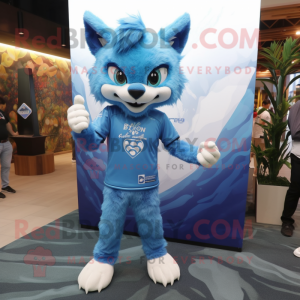 Blue Lynx mascot costume character dressed with a Cover-up and Brooches