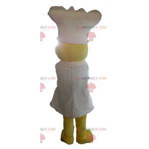 Geel kuiken mascotte met een schort en een witte hoed -