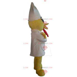Geel kuiken mascotte met een schort en een witte hoed -