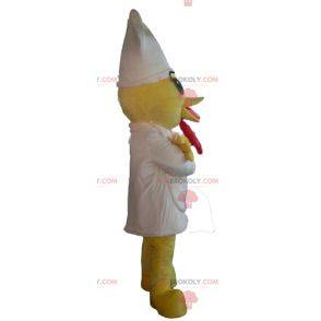 Mascot yellow chick with an apron and a white hat -