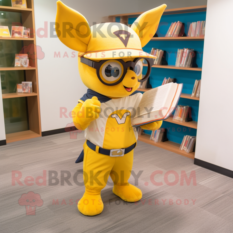 Yellow Bat mascot costume character dressed with a Baseball Tee and Reading glasses