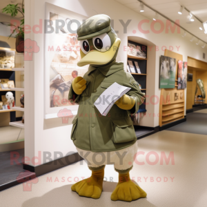 Olive Swan mascot costume character dressed with a Trousers and Caps